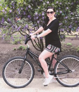 Sara on a bike